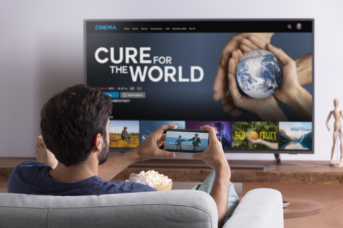 Man watching a streaming service on his TV