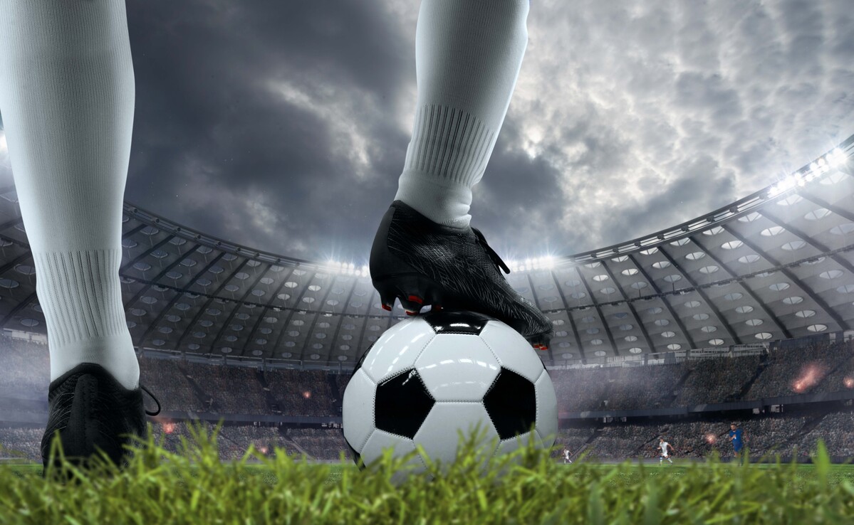 Professional soccer players competing during a Premier League football match